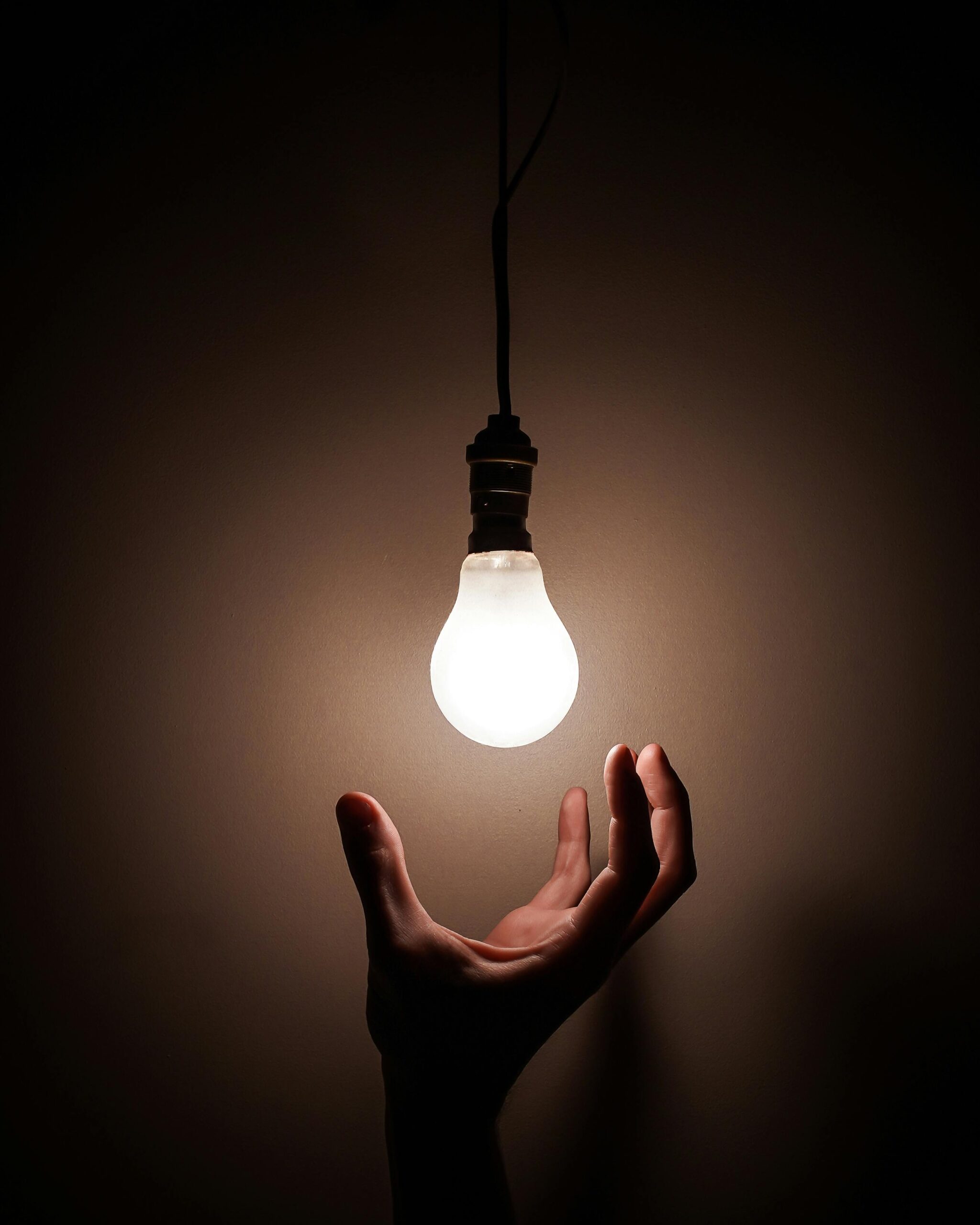 Hand reaching for light.