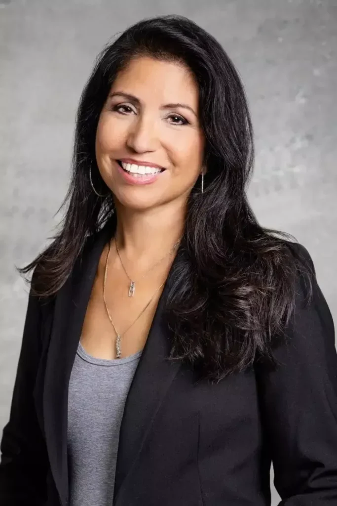 Professional headshot of a smiling woman