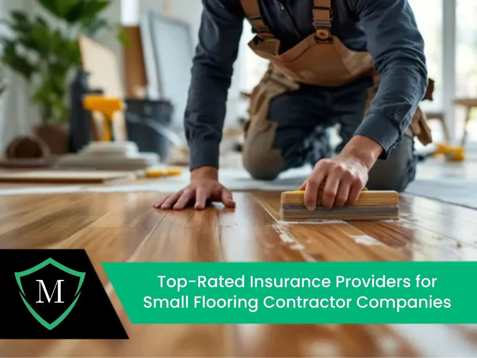 A professional flooring contractor in workwear kneeling on a light wood floor, using a specialized wooden tool to install or align planks during a home renovation.