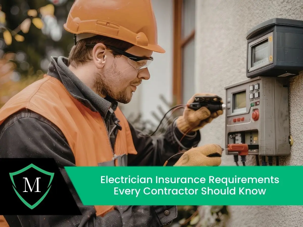 An electrician in safety gear working on an exterior electrical panel.