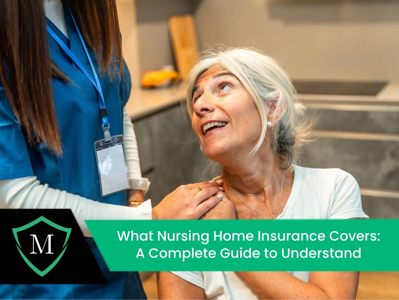 A caregiver in a blue uniform with an ID badge gently places a hand on the shoulder of an elderly woman who is smiling up at her.