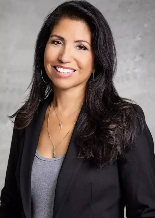 Professional headshot of a smiling woman
